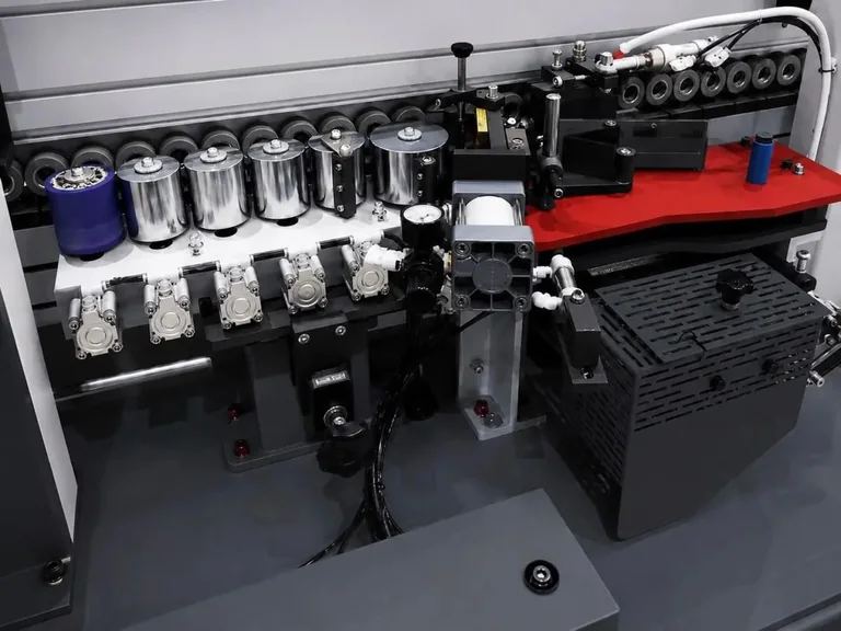 Glue pot for EVA adhesive and multi-roller pressing section with pneumatic loading