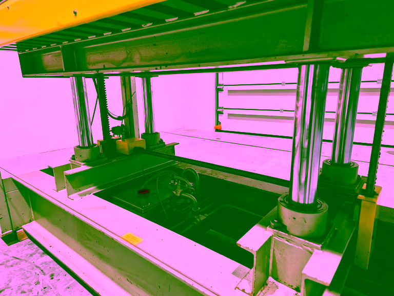 Pressing cylinders and hydraulic unit under the lower platen